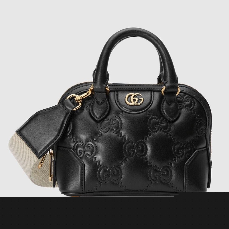G*u*i top handle bags